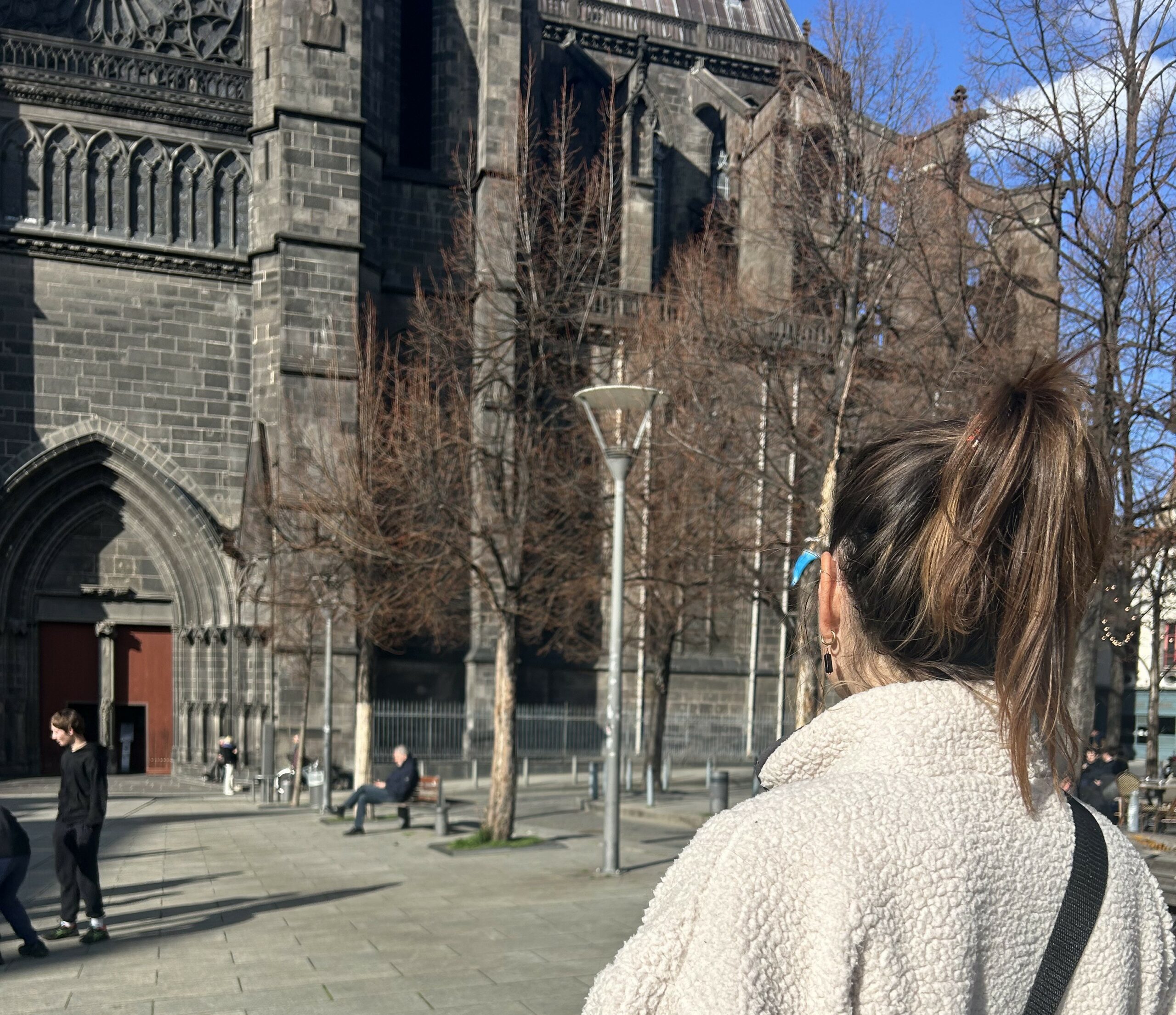 Woman looking at the Cathedral in Clermont-Ferrand